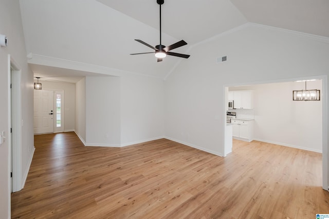 4022 Cambridge Dr, Moody, AL 35004 - unfurnished living room with a chandelier, light wood finished floors, a ceiling fan, and high vaulted ceiling
