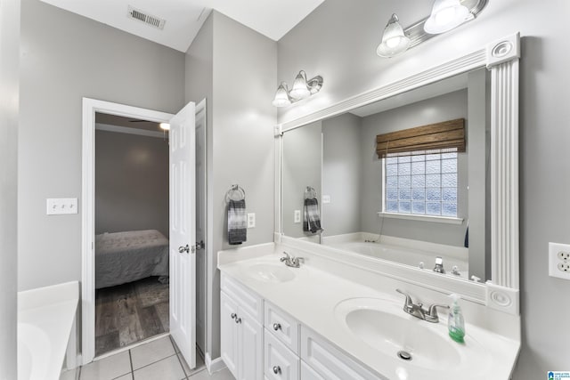 4114 Jubilee Ln, Moody, AL 35004 - bathroom with ensuite bath, a garden tub, double vanity, and tile patterned flooring