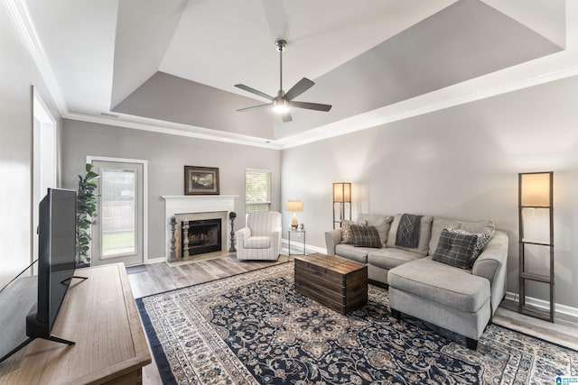 4114 Jubilee Ln, Moody, AL 35004 - living room with a tray ceiling, ceiling fan, plenty of natural light, wood finished floors, and ornamental molding