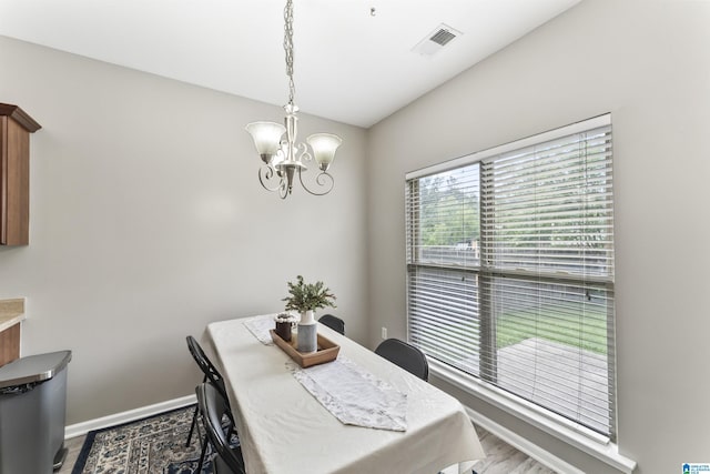 4114 Jubilee Ln, Moody, AL 35004 - dining area featuring a chandelier and wood finished floors