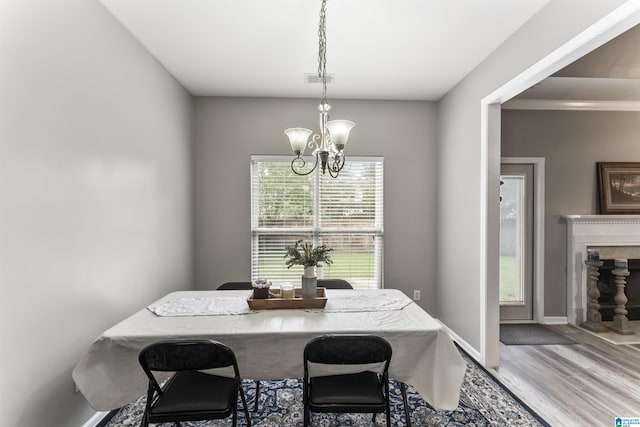 4114 Jubilee Ln, Moody, AL 35004 - dining room featuring a chandelier, wood finished floors, and a high end fireplace