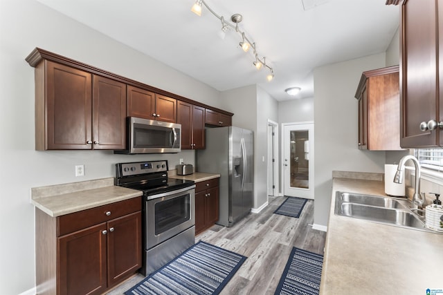 4114 Jubilee Ln, Moody, AL 35004 - kitchen featuring appliances with stainless steel finishes, light wood finished floors, and light countertops