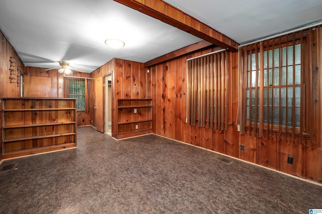 805 Vanderbilt St, Birmingham, AL 35206 - empty room featuring ceiling fan and wood walls