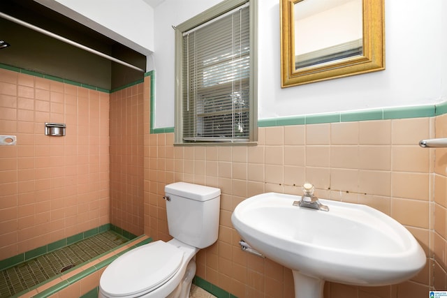 805 Vanderbilt St, Birmingham, AL 35206 - full bathroom with a stall shower, a wainscoted wall, and tile walls