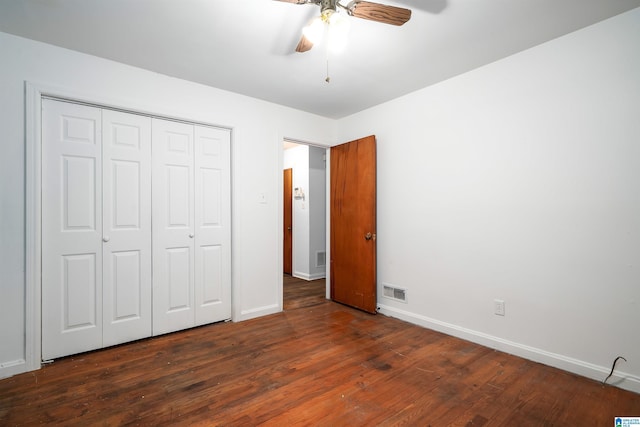 805 Vanderbilt St, Birmingham, AL 35206 - unfurnished bedroom with dark wood finished floors, a closet, and a ceiling fan