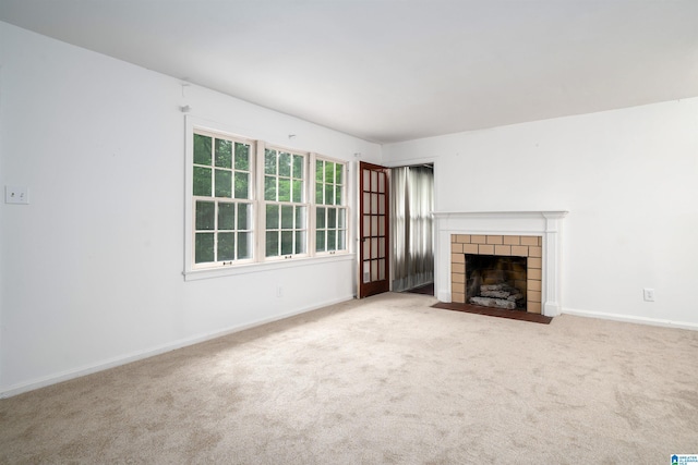 805 Vanderbilt St, Birmingham, AL 35206 - unfurnished living room with a tile fireplace and carpet floors