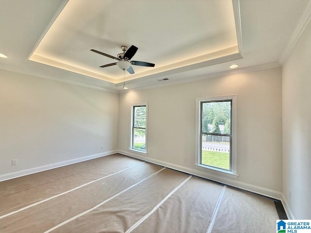 1029 Creel Dr, Moody, AL 35004 - carpeted empty room with a tray ceiling, crown molding, ceiling fan, and recessed lighting