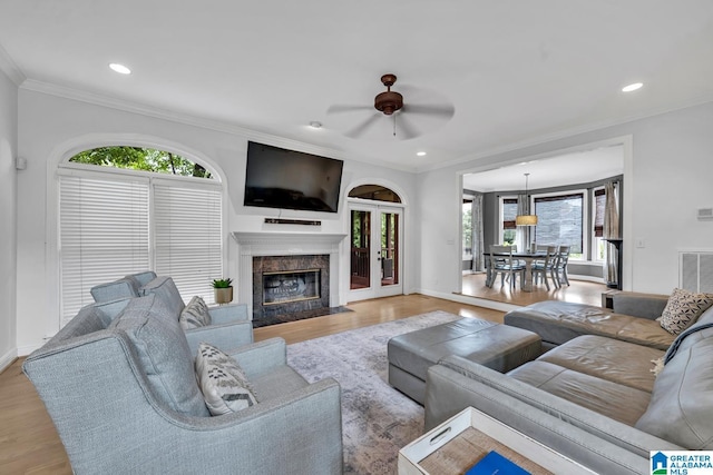 5012 Lake Crest Cir, Hoover, AL 35226 - living area with healthy amount of natural light, ceiling fan, wood finished floors, a fireplace, and crown molding