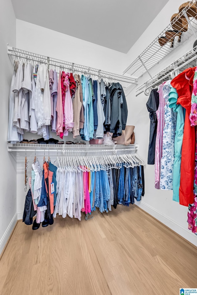 5012 Lake Crest Cir, Hoover, AL 35226 - walk in closet with wood finished floors