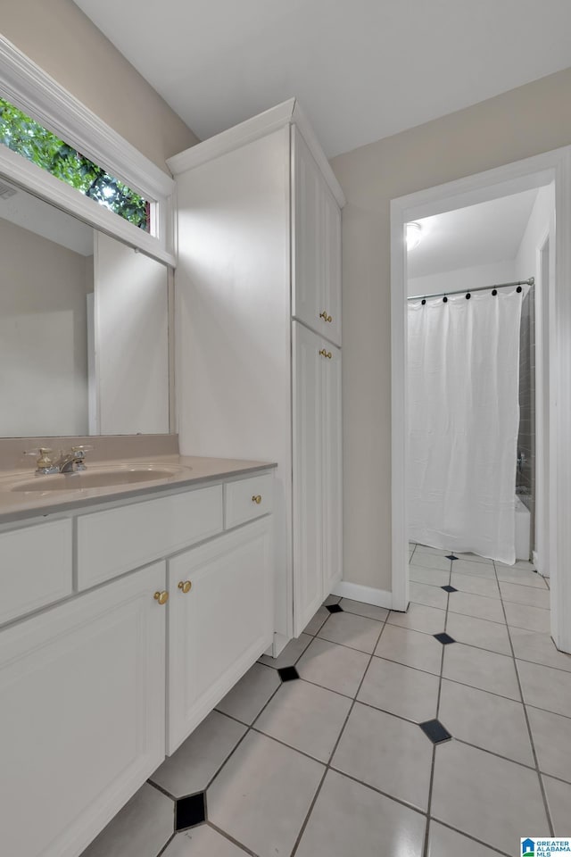 5012 Lake Crest Cir, Hoover, AL 35226 - full bathroom with vanity, shower / bath combo with shower curtain, and tile patterned flooring