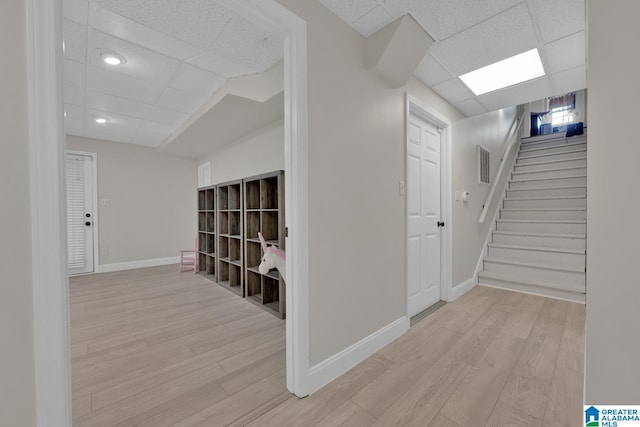 5012 Lake Crest Cir, Hoover, AL 35226 - hallway featuring a drop ceiling, light wood-type flooring, and stairway