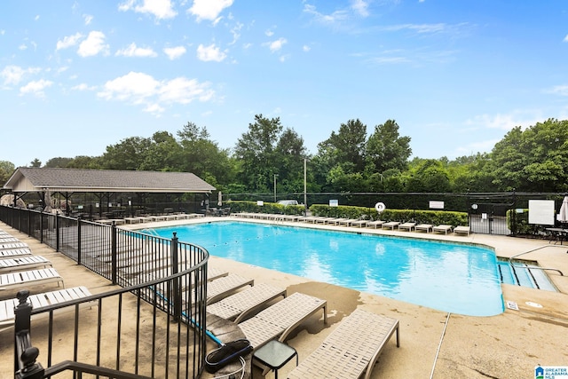 5012 Lake Crest Cir, Hoover, AL 35226 - community pool with view of scattered trees and a patio area