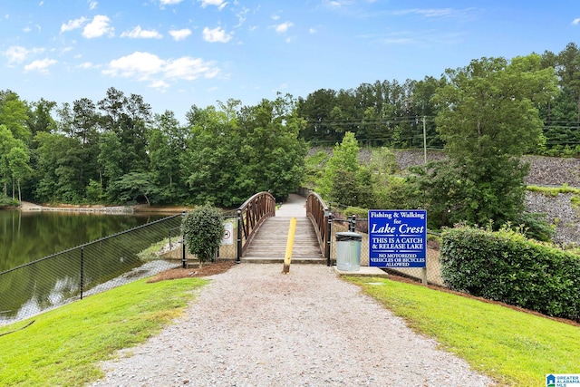 5012 Lake Crest Cir, Hoover, AL 35226 - view of community featuring a water view, driveway, and a forest view