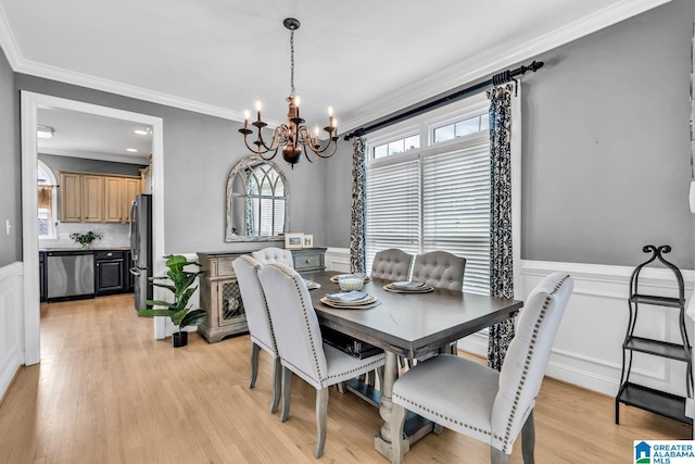 5012 Lake Crest Cir, Hoover, AL 35226 - dining room with a chandelier, crown molding, healthy amount of natural light, wainscoting, and light wood-style flooring