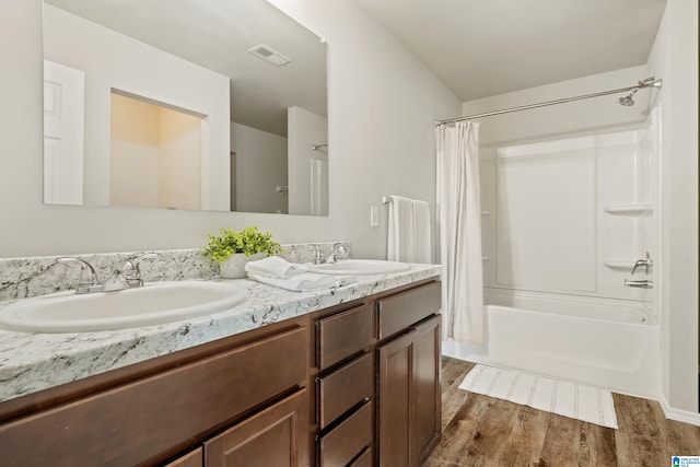 240 Hillcrest Dr, Montevallo, AL 35115 - bathroom with double vanity, shower / bath combo, and wood finished floors