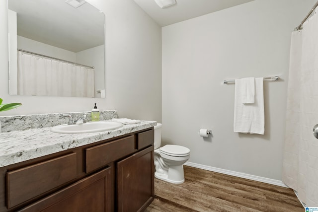 240 Hillcrest Dr, Montevallo, AL 35115 - full bathroom featuring wood finished floors, vanity, and a shower with curtain