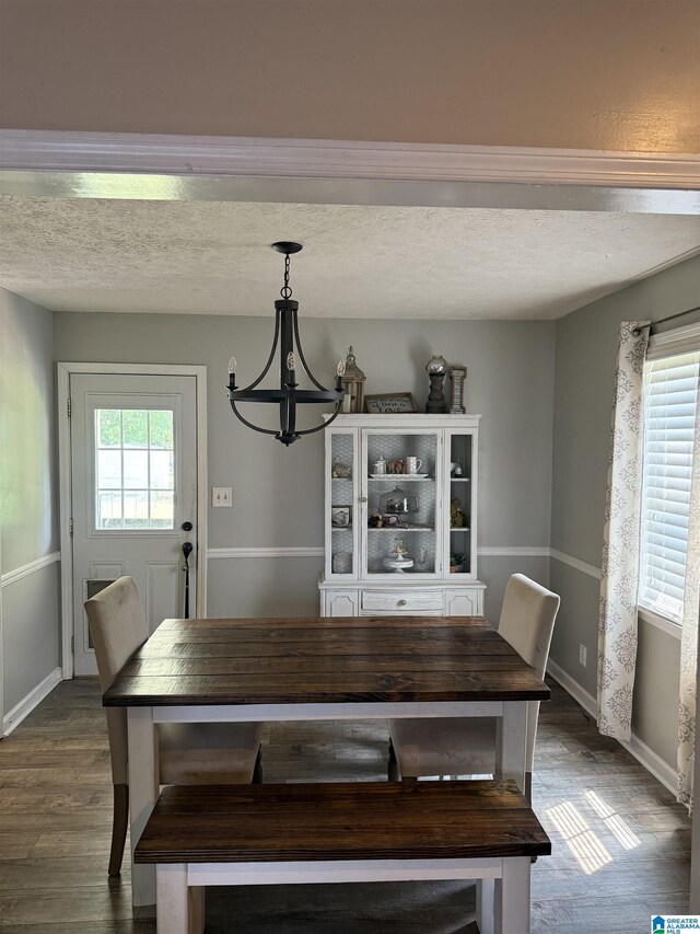 1500 Rockview Cir, Weaver, AL 36277 - dining room featuring a chandelier, dark wood-style flooring, and a textured ceiling