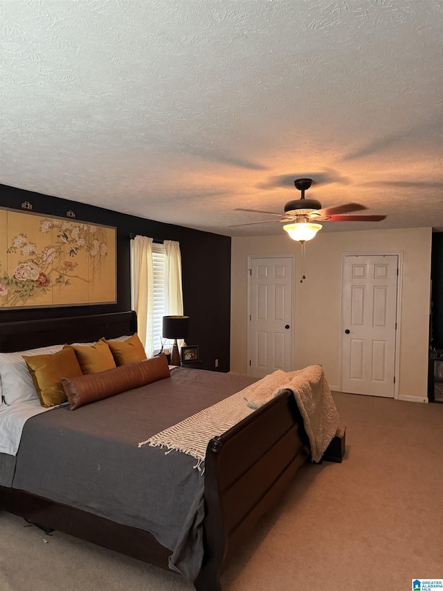 1500 Rockview Cir, Weaver, AL 36277 - bedroom with a textured ceiling, ceiling fan, and carpet flooring