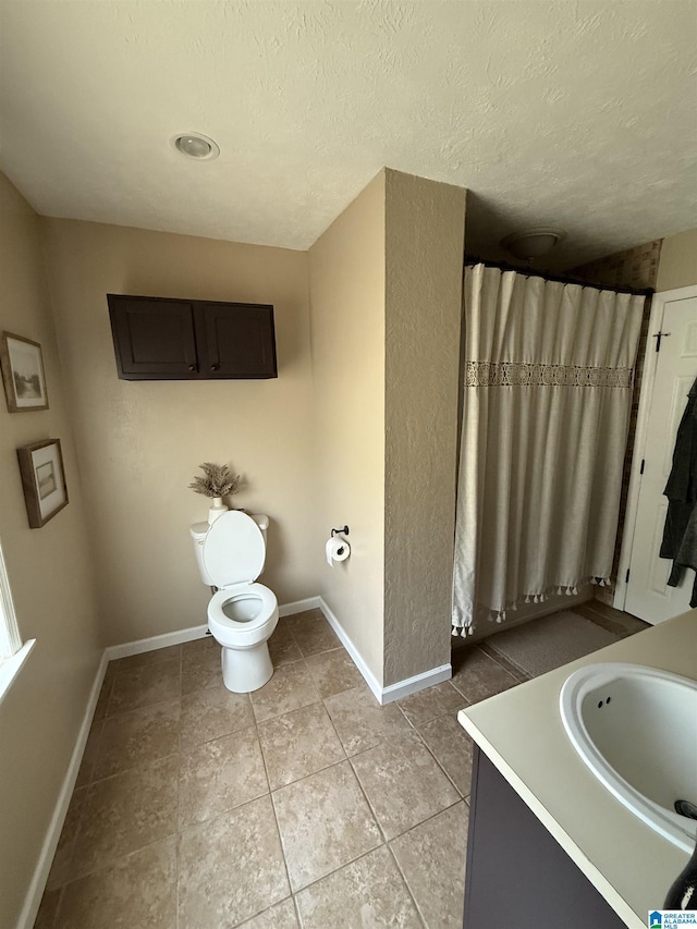 1500 Rockview Cir, Weaver, AL 36277 - bathroom featuring tile patterned floors, vanity, a textured ceiling, and a shower with shower curtain