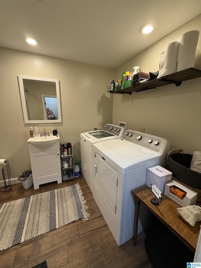 1500 Rockview Cir, Weaver, AL 36277 - laundry area featuring independent washer and dryer, dark wood-style flooring, and recessed lighting