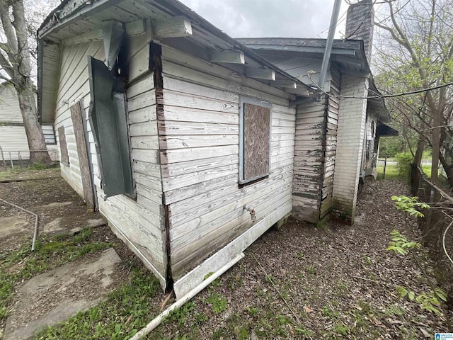 4704 9th Ave, Birmingham, AL 35224 - view of home's exterior with a chimney