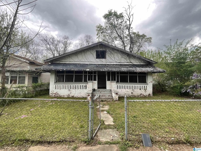 4704 9th Ave, Birmingham, AL 35224 - bungalow with covered porch, a front yard, and brick siding