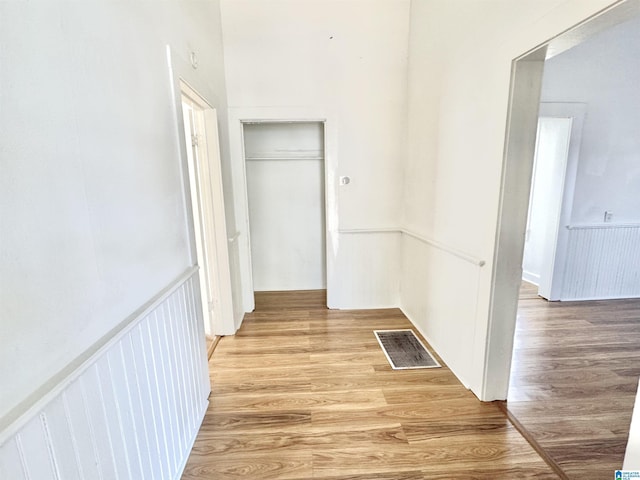 7604 3rd Ave S, Birmingham, AL 35206 - hallway featuring light wood-style floors and a wainscoted wall