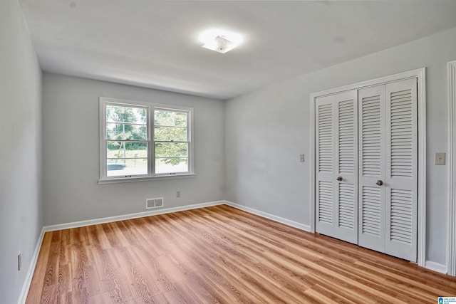 1257 Hueytown Rd, Hueytown, AL 35023 - unfurnished bedroom with light wood-type flooring and a closet