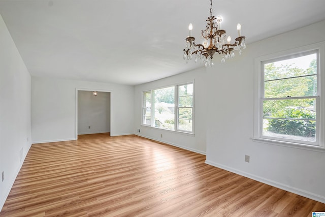 1257 Hueytown Rd, Hueytown, AL 35023 - spare room with plenty of natural light, light wood-style floors, and a chandelier