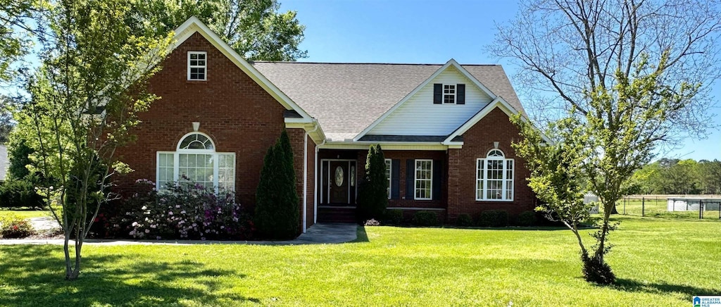 2841 Yellow Leaf Rd, Clanton, AL 35045 - traditional home featuring a front yard, brick siding, and a shingled roof