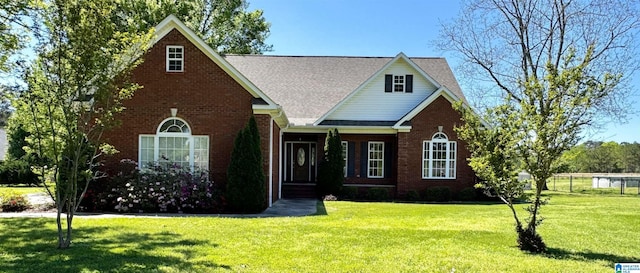 2841 Yellow Leaf Rd, Clanton, AL 35045 - traditional home featuring a front yard, brick siding, and a shingled roof