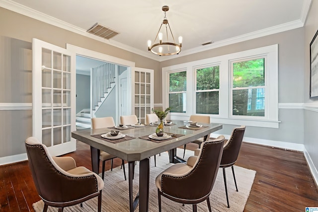 1701 S 16th Ave, Birmingham, AL 35205 - dining room with a chandelier, dark wood-type flooring, crown molding, and stairs
