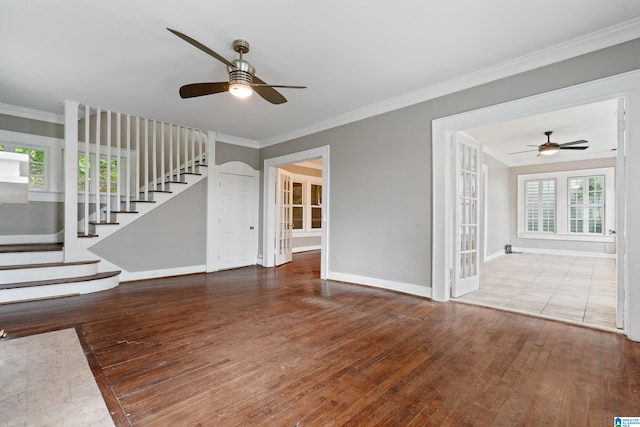 1701 S 16th Ave, Birmingham, AL 35205 - unfurnished living room with a ceiling fan, wood-type flooring, stairs, and ornamental molding