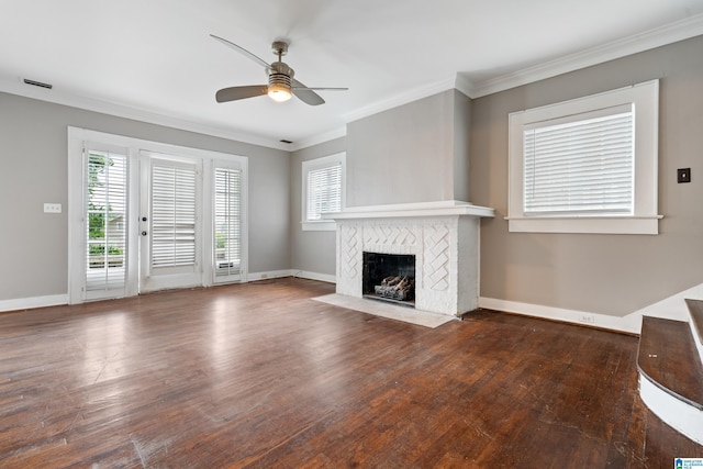 1701 S 16th Ave, Birmingham, AL 35205 - unfurnished living room featuring a ceiling fan, wood finished floors, crown molding, healthy amount of natural light, and a fireplace with flush hearth