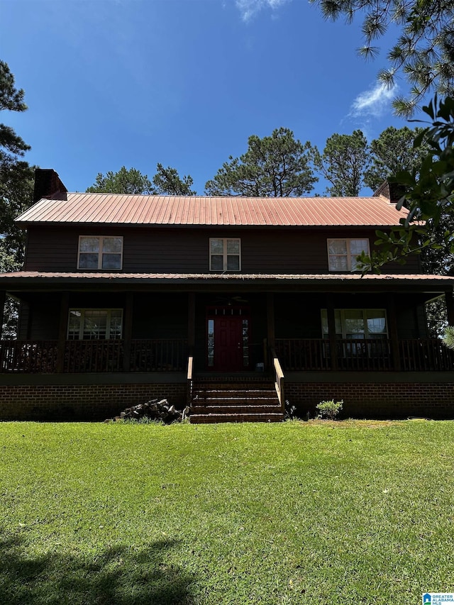 76 Goggins Dr, Montevallo, AL 35115 - farmhouse inspired home with a metal roof, a front lawn, covered porch, and a chimney