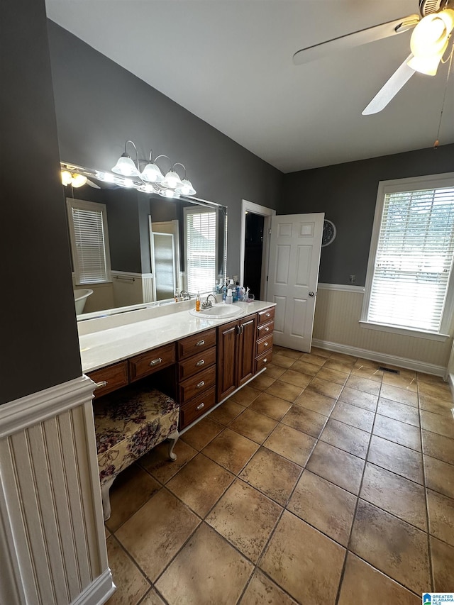76 Goggins Dr, Montevallo, AL 35115 - bathroom with ceiling fan, a wainscoted wall, vanity, plenty of natural light, and tile patterned flooring