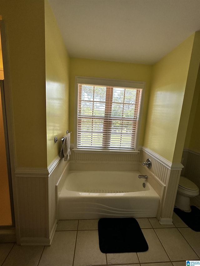 76 Goggins Dr, Montevallo, AL 35115 - full bathroom featuring tile patterned floors, a wainscoted wall, and a bath