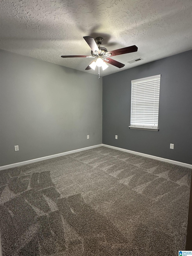 426 Bailey Rd, Weaver, AL 36277 - spare room featuring ceiling fan, a textured ceiling, and carpet flooring
