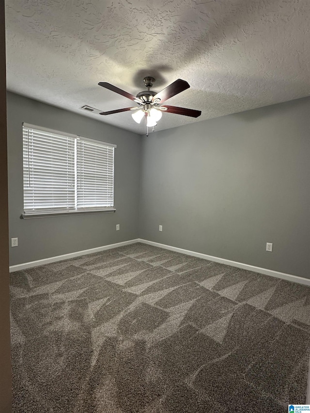426 Bailey Rd, Weaver, AL 36277 - spare room with a textured ceiling, a ceiling fan, and carpet floors