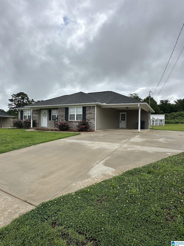 426 Bailey Rd, Weaver, AL 36277 - ranch-style home with driveway, an attached carport, and a front yard