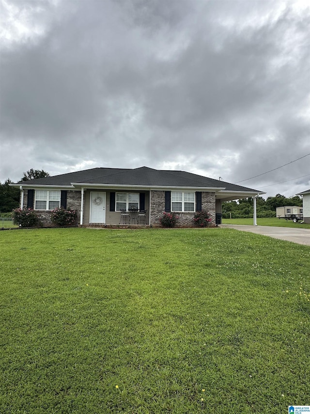 426 Bailey Rd, Weaver, AL 36277 - ranch-style home featuring driveway, a carport, and a front lawn