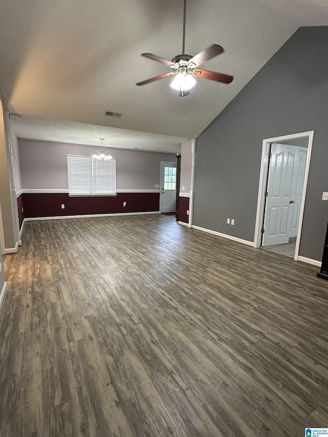 426 Bailey Rd, Weaver, AL 36277 - unfurnished living room featuring ceiling fan, dark wood-style floors, a chandelier, and lofted ceiling