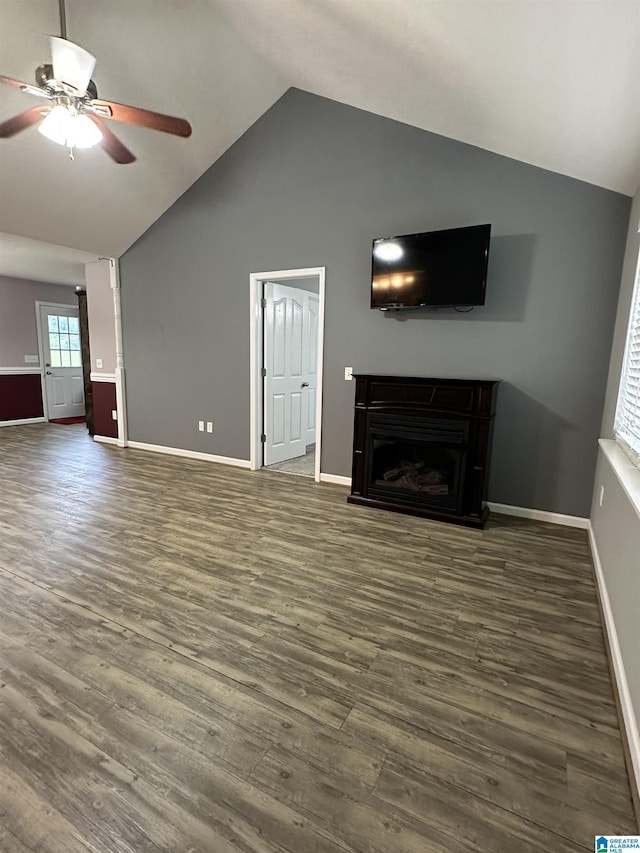 426 Bailey Rd, Weaver, AL 36277 - unfurnished living room featuring lofted ceiling, dark wood-style floors, a ceiling fan, and a fireplace