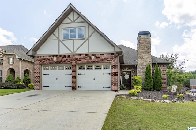 1120 Weybridge Way, Pelham, AL 35124 - tudor-style house with brick siding, concrete driveway, and a front yard