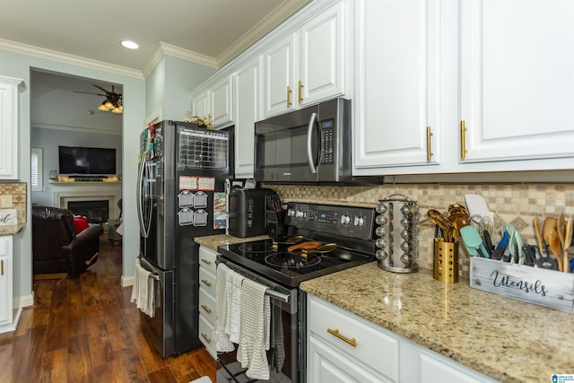 1120 Weybridge Way, Pelham, AL 35124 - kitchen with electric range, stainless steel microwave, freestanding refrigerator, white cabinets, and crown molding