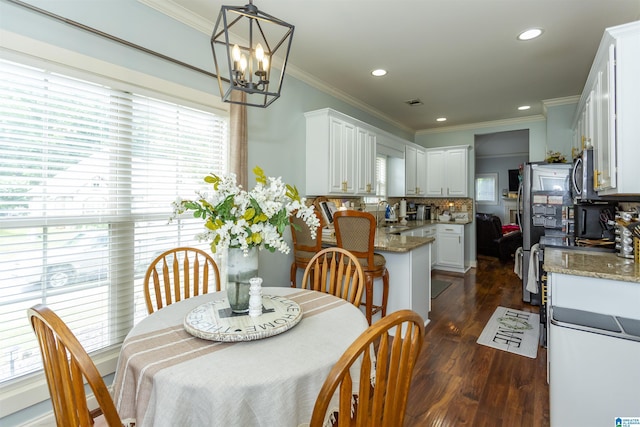 1120 Weybridge Way, Pelham, AL 35124 - dining area featuring healthy amount of natural light, a chandelier, dark wood-type flooring, ornamental molding, and recessed lighting