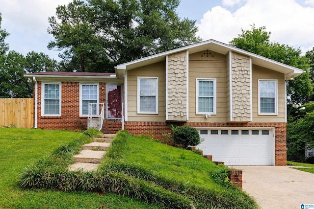 2517 Wright Cir, Birmingham, AL 35235 - view of front of home featuring a garage, concrete driveway, and brick siding