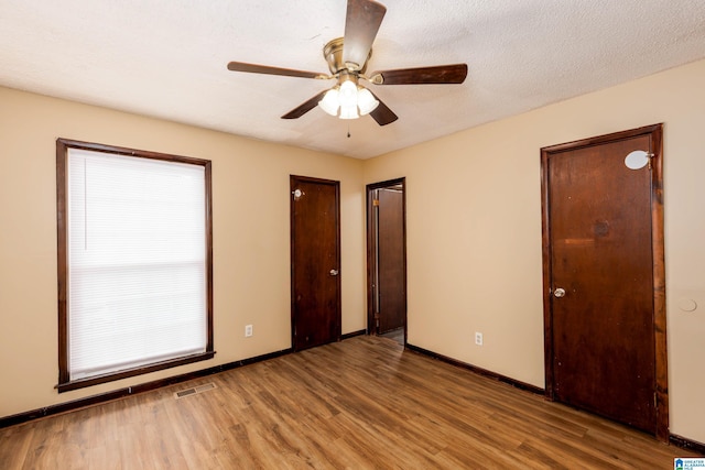 2517 Wright Cir, Birmingham, AL 35235 - unfurnished bedroom with wood finished floors and ceiling fan