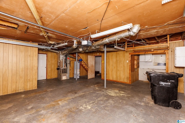 2517 Wright Cir, Birmingham, AL 35235 - unfinished below grade area featuring water heater, heating unit, and wood walls