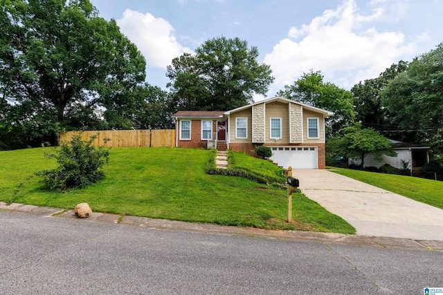 2517 Wright Cir, Birmingham, AL 35235 - view of front facade with brick siding, concrete driveway, and a garage